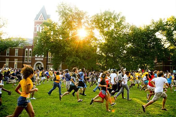 First year students running through the Columns during Tiger Walk